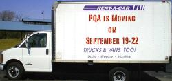 Moving Truck with message on the side that reads PQA is moving September 19 through 22